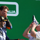 McLaren CEO Zak Brown drinks from Daniel Ricciardo's shoe on the Monza podium.